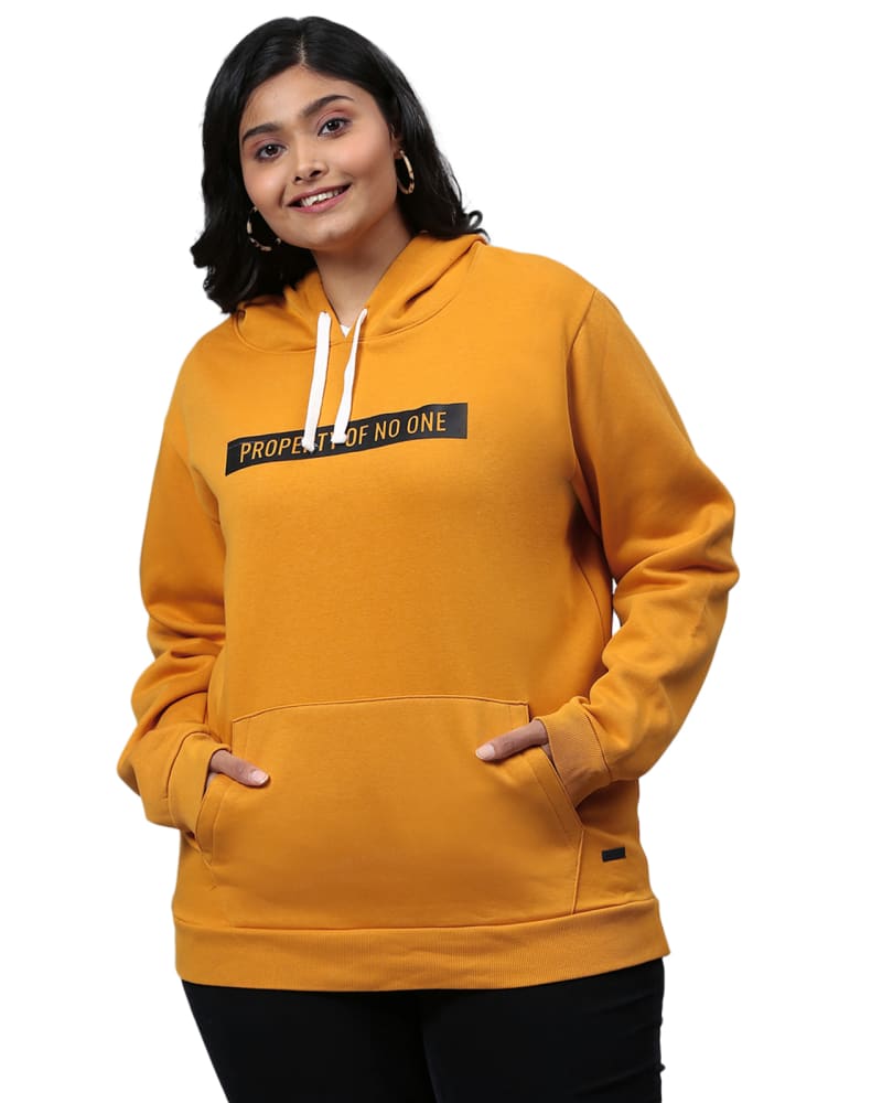 Front of a model wearing a size 5XL Mustard "Property of No One" Sweatshirt in Mustard by Instafab Plus. | dia_product_style_image_id:298374